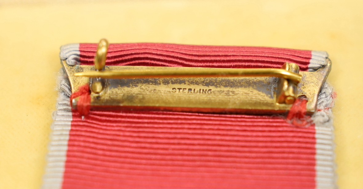 A cased O.B.E. Medal